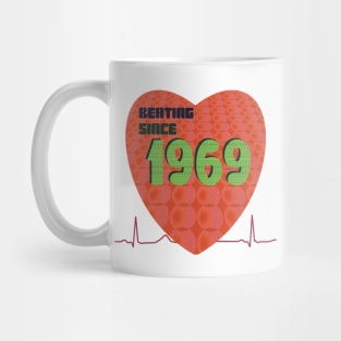 1969 heart beating since with orange overlay pattern Mug